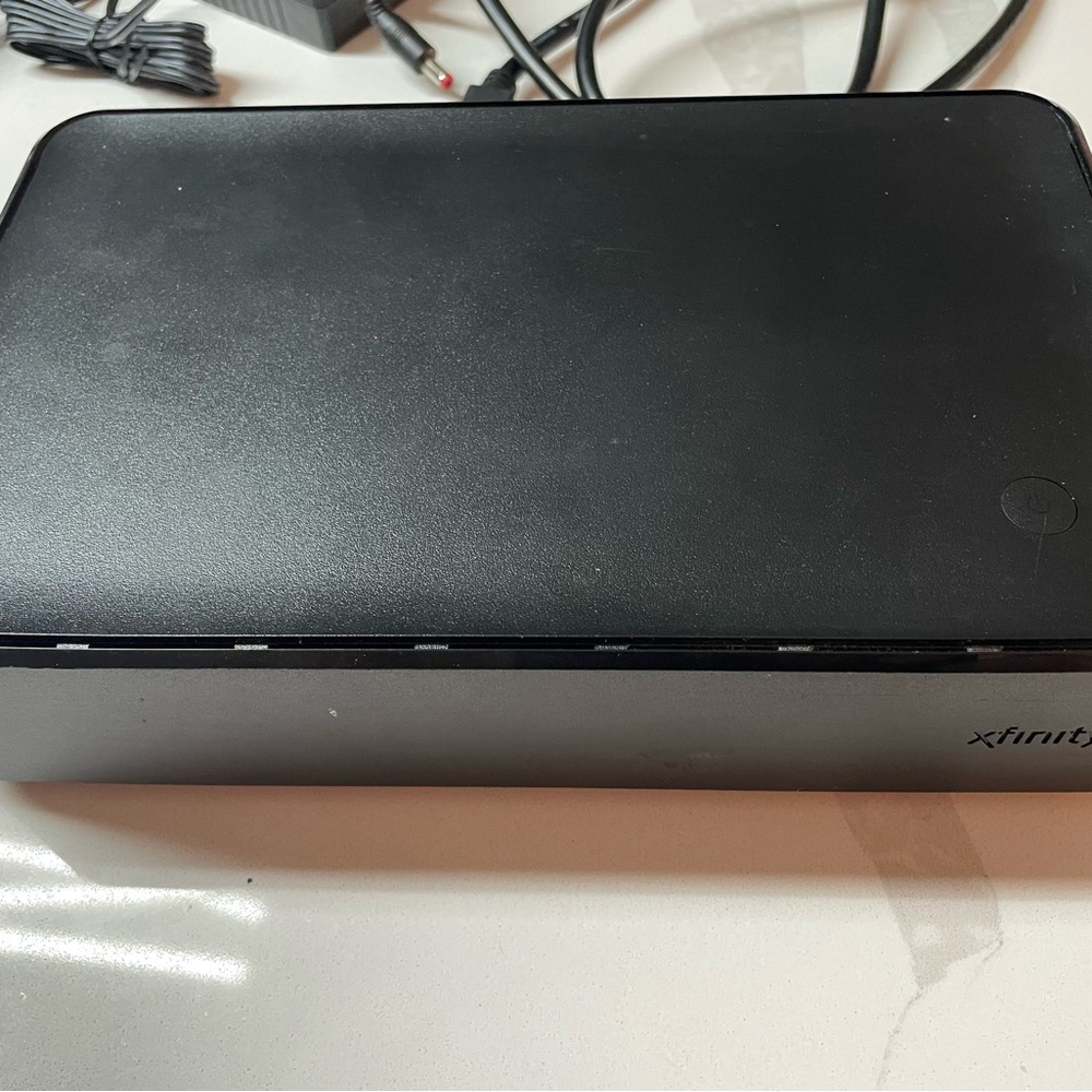 Comcast Xfinity HD cable box with adapter and HDMI cable